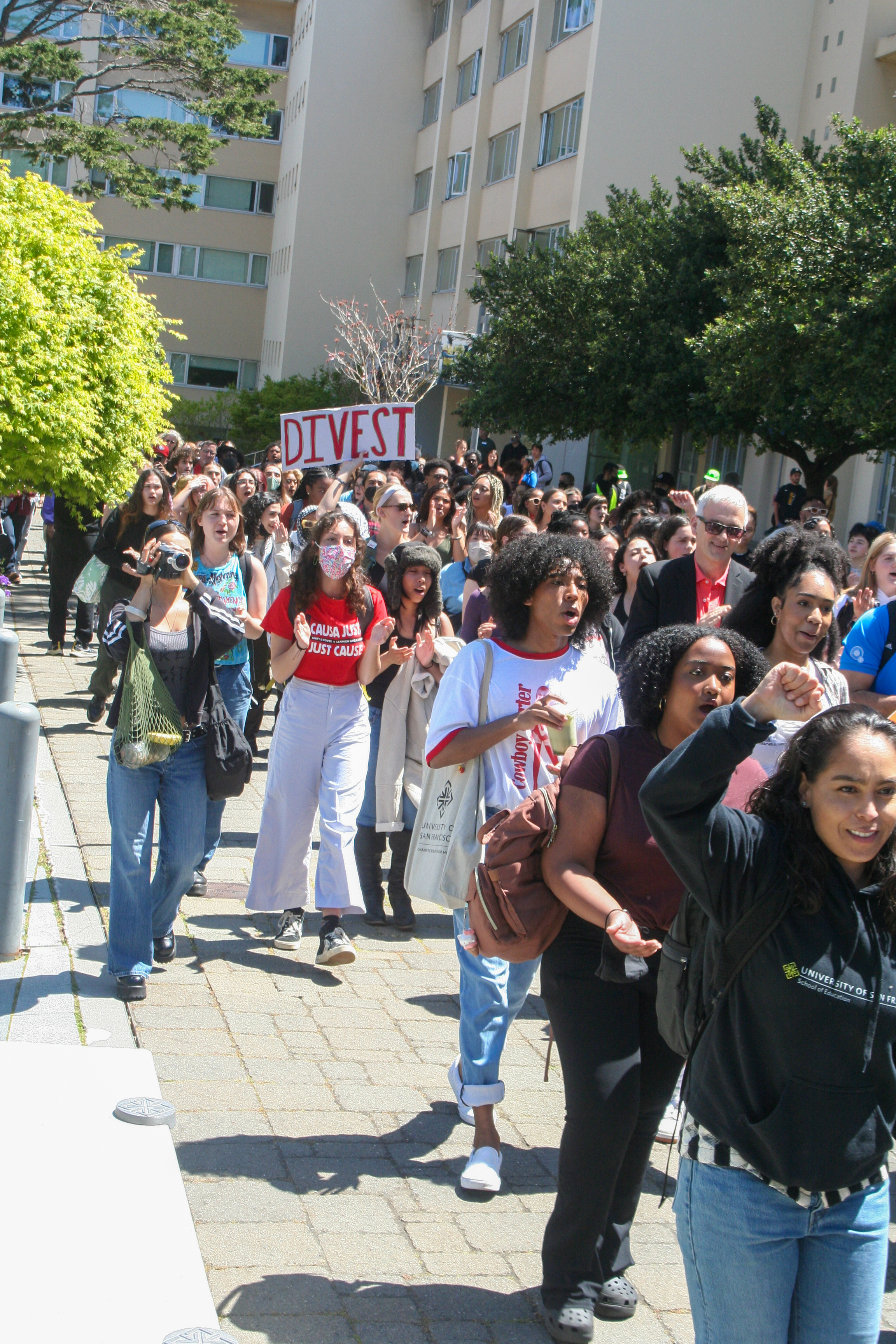 students marching to the lawn. the middle of the crowd