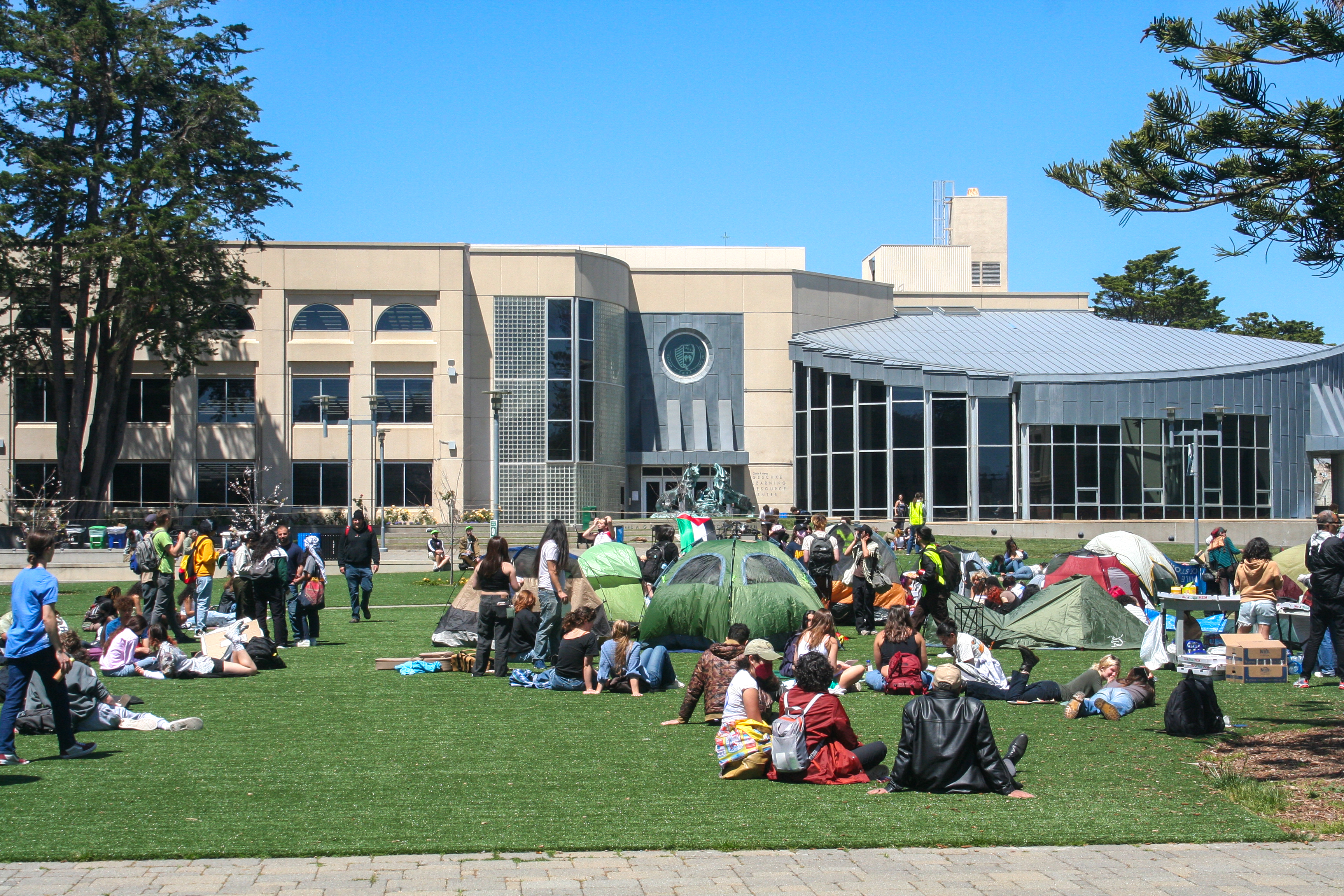 the same establishing shot of the lawn, now occupied